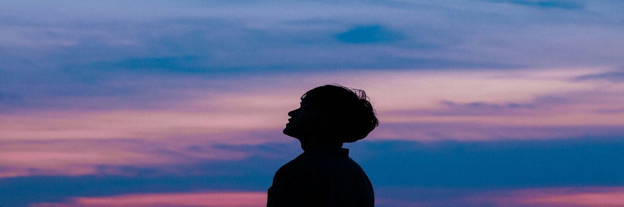 a man is looking up to the sky