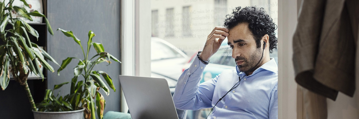 A man is using a computer