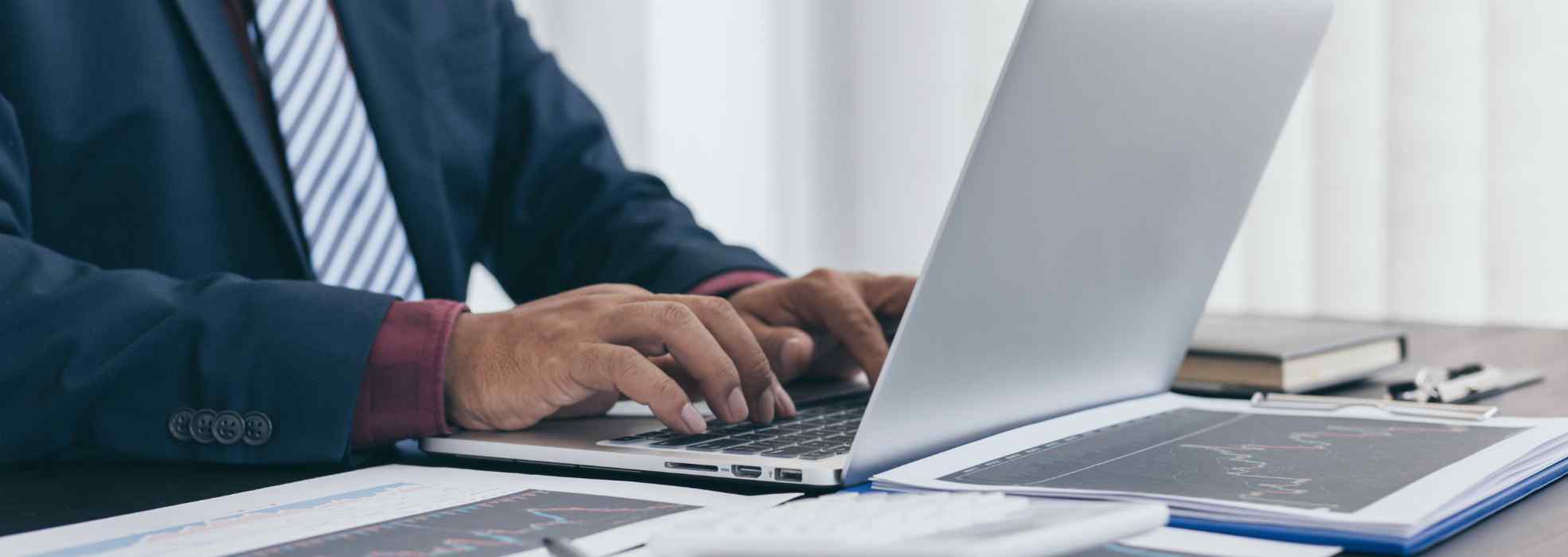 A person is typing on the keyboard