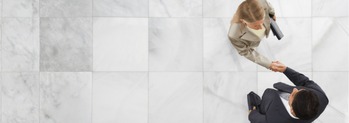 two-working-people-shaking-hands