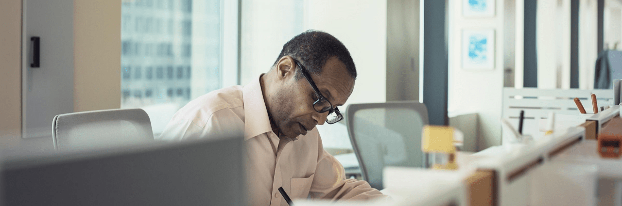 An image of a man calculating accounts-receivable