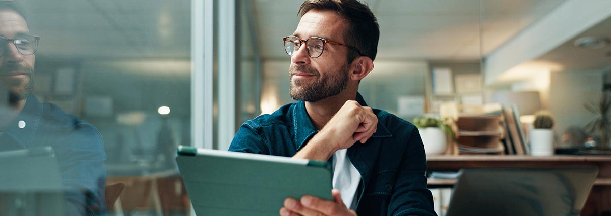 Tablet, thinking and smile with business man in office for planning