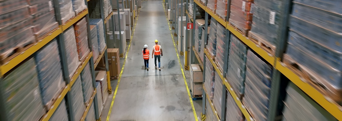 2 workers in a storage facility