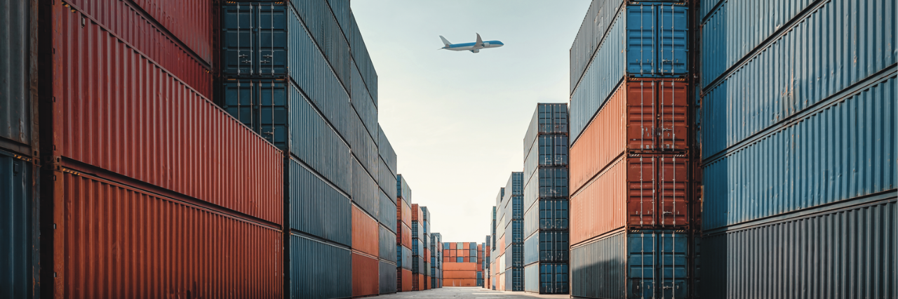 2 children in a classroom working with a tablet