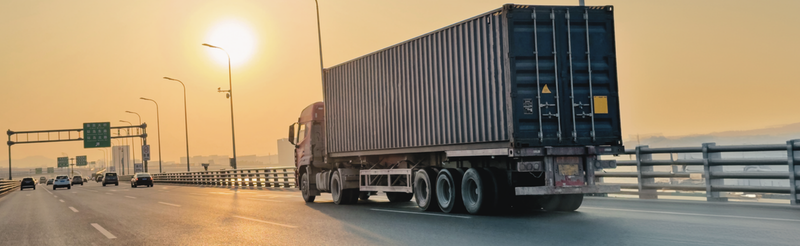 2 children in a classroom working with a tablet